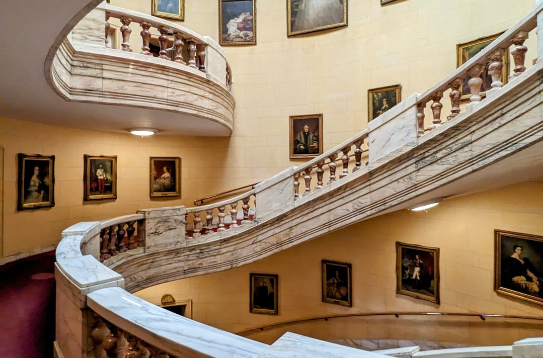 A winding historical stairwell at the Royal Horseguard Hotel