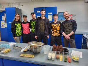 The Fooditude Team running a cookery demo session for Trinity Comprehensive school on behalf of business in the community Ireland.