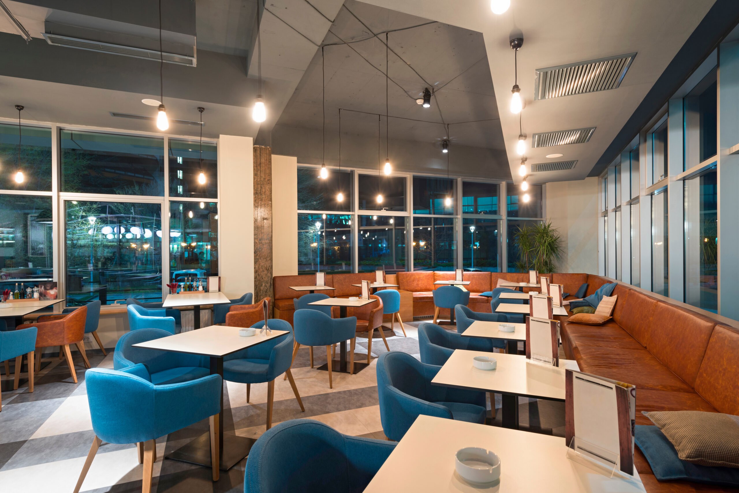 A modern office dining experience with seats and a coffee station
