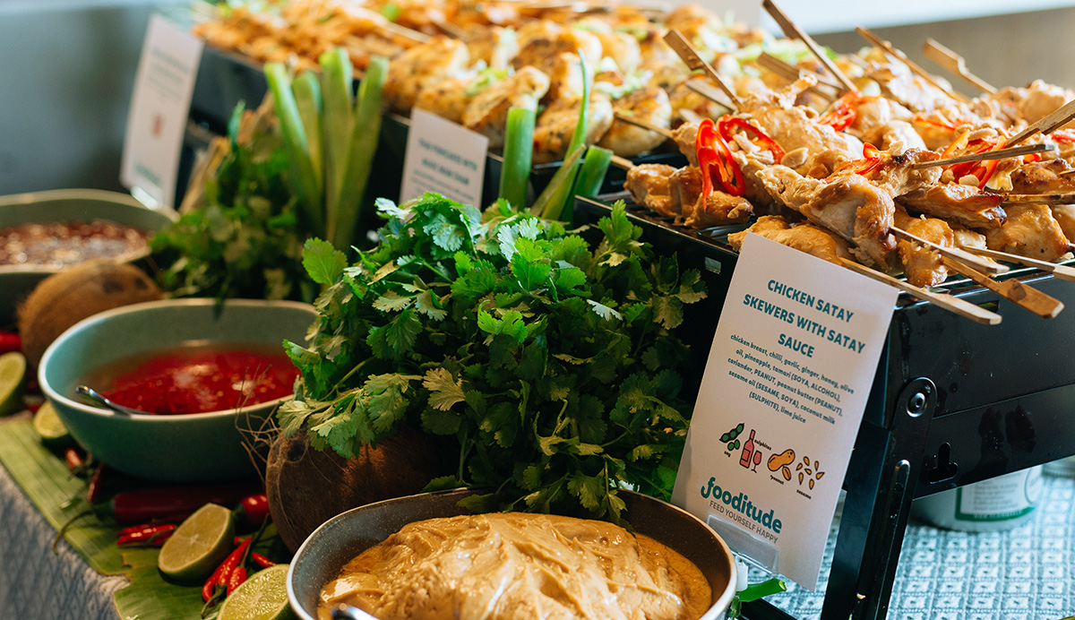 Corporate catering company providing an office caterer hot buffet with allergy labelling.