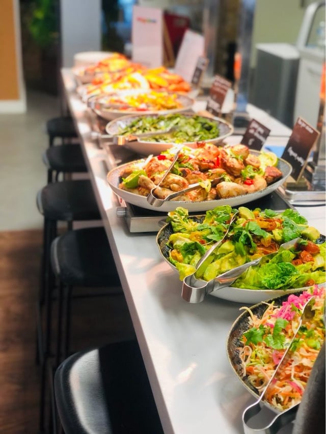 Healthy and fresh shared meals offered by a corporate caterer.