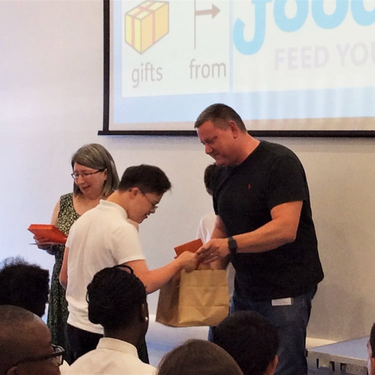Our Managing Director passing out gifts to the students of Highshore. 