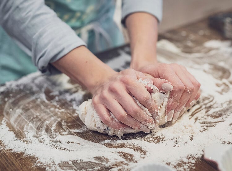 Chef rolling and kneading the dough to make dough balls