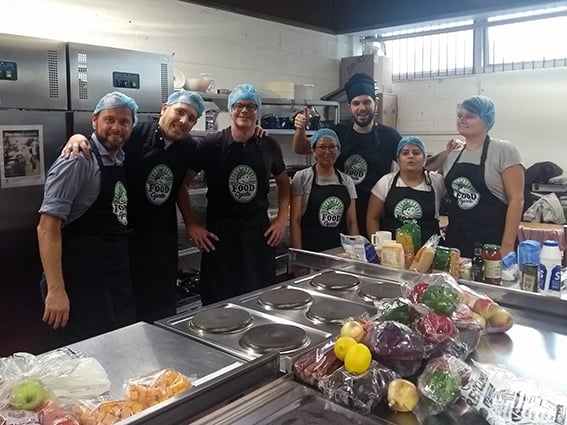 Photography of some Fooditude Members working in the kitchen.