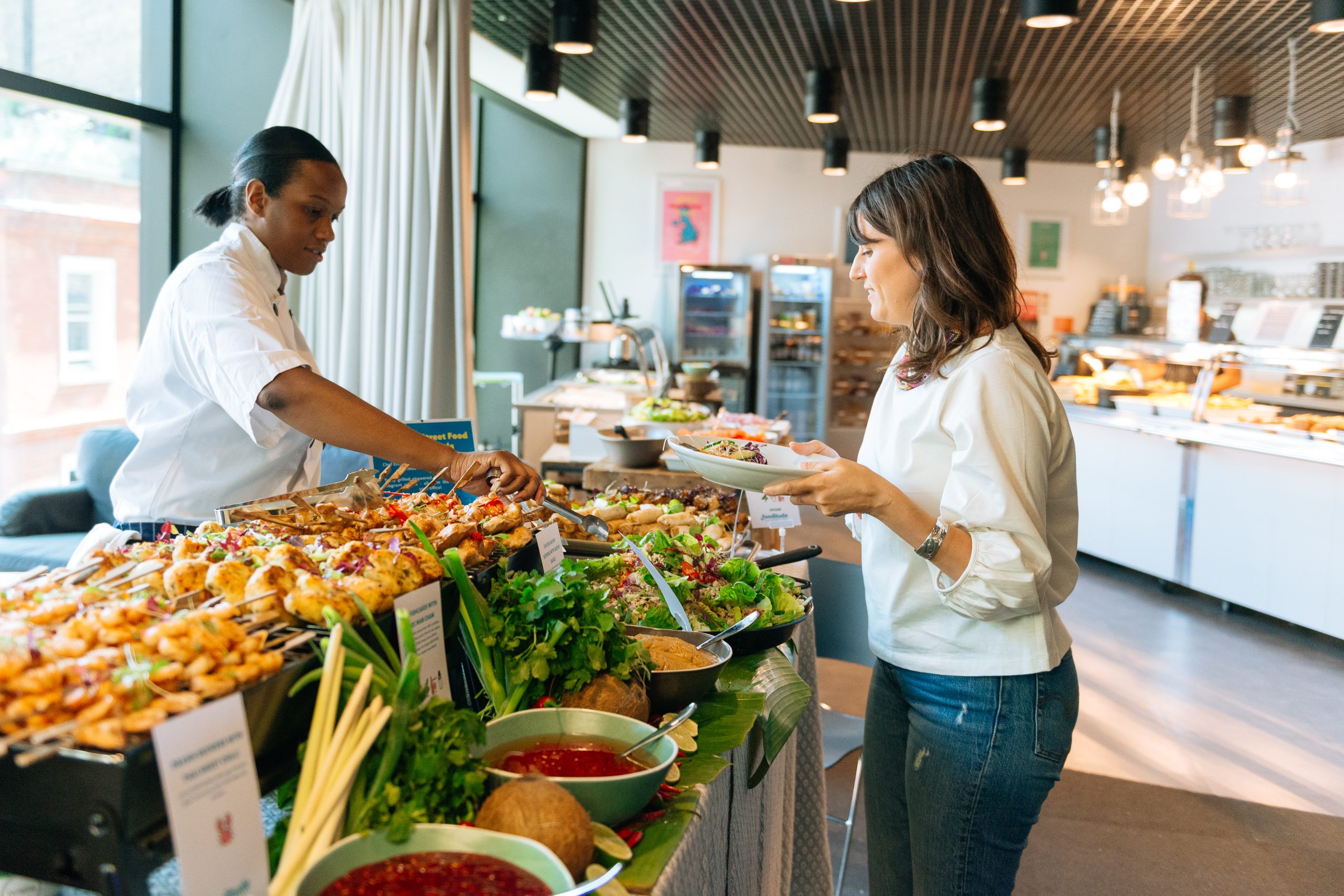 Employee choosing pop up event food at the office canteen