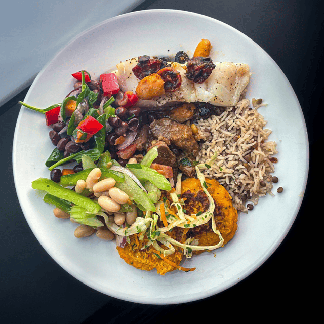 Photograph of an employee's lunch plate curated from a buffet lunch by contract caterer: Fooditude.