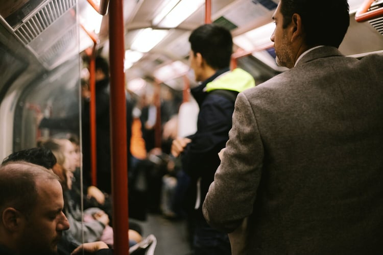 Picture of commuters on the london underground tube getting to work.