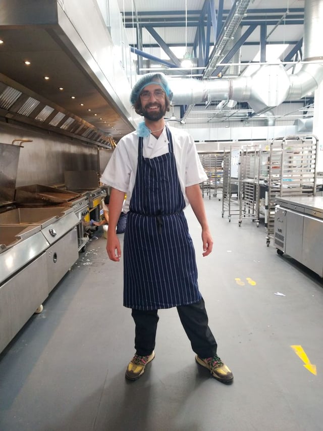 Marketing employee James at contract catering company Fooditude, tries being a chef for the day, this photo is him in his chef attire.