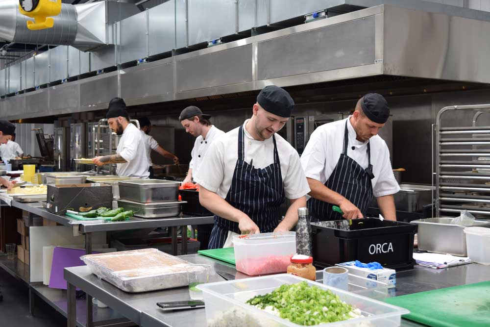 Male chefs working in a kitchen