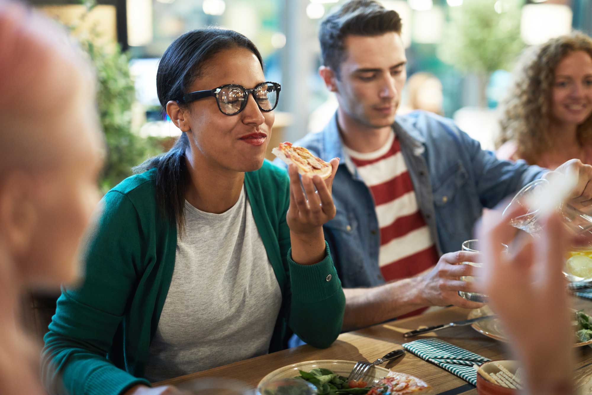 Woman eating at a table