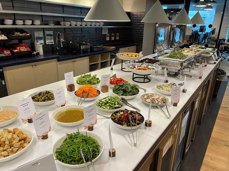 A table containing bowls of food 