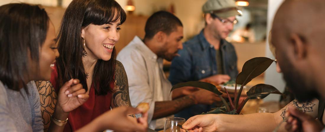 A group of people eating at a table