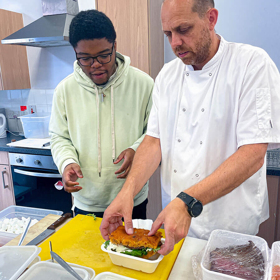 2 chefs preparing a meal